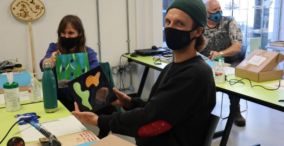 Participants Chloe Georgakis and Will Harvey with their reverse glass paintings (Photo credit: Smart Citizens Programme)