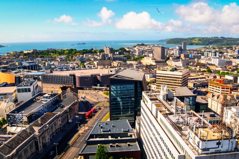 Plymouth city centre with Plymouth Hoe and Sound backdrop